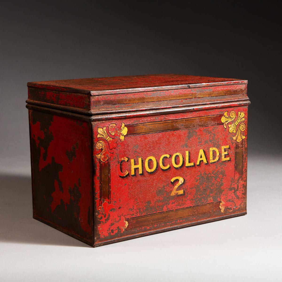 A 19th Century Red Tole Chocolate Tin