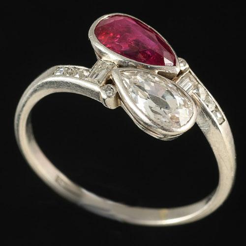 Platinum and gold ruby and diamond pear shaped crossover ring