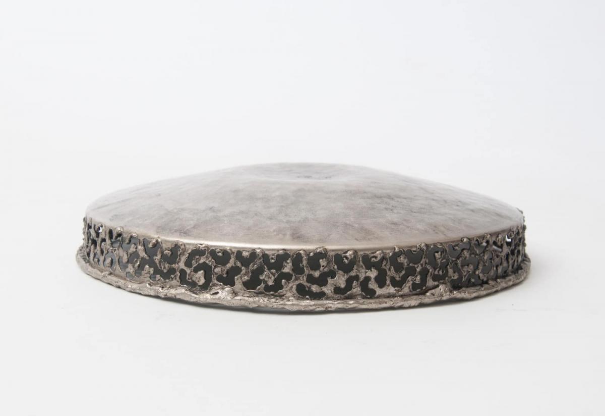 Torch cut and hammered metal bowl by Marcello Fantoni