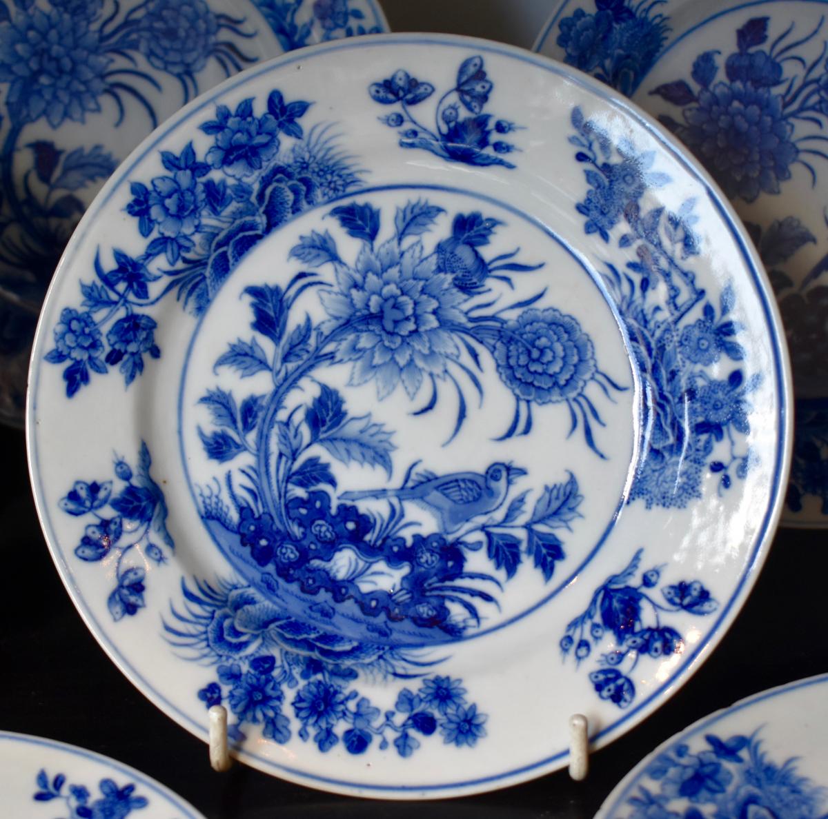 A set of 5 blue and white plates