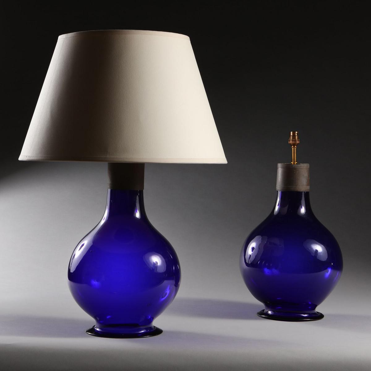 A Pair of Imperial Blue Glass Lamps