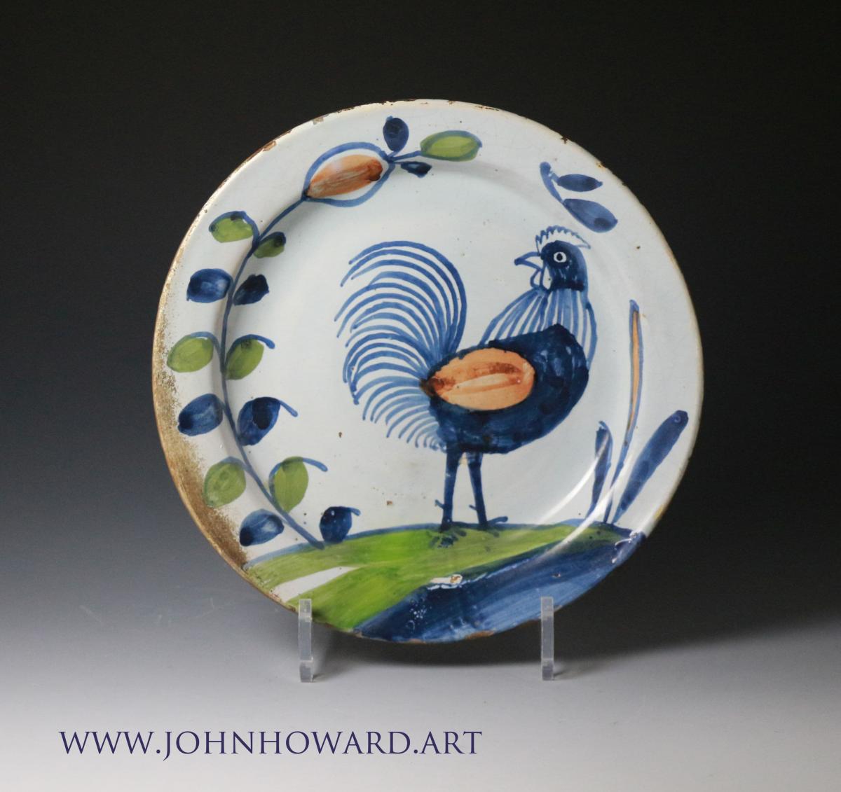 English delftware pottery plate with image of a rooster antique period circa 1725 period
