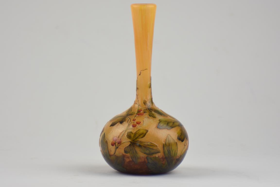 Daum vase decorated with leaves and berries