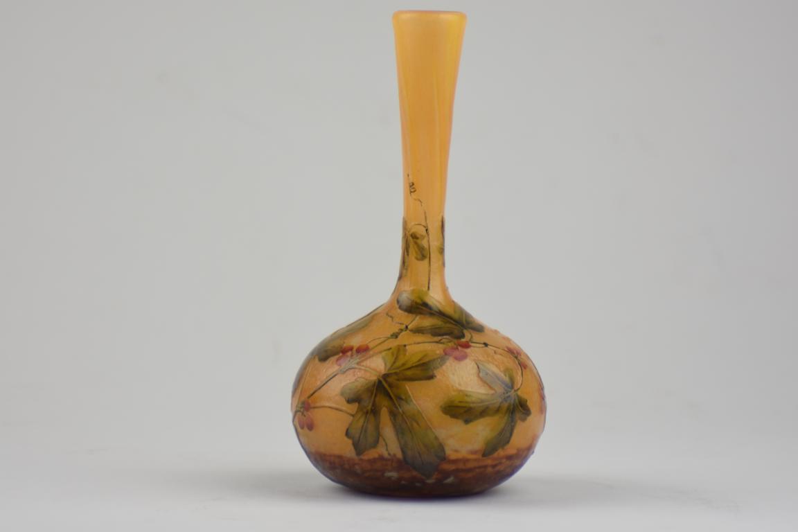 Daum vase decorated with leaves and berries