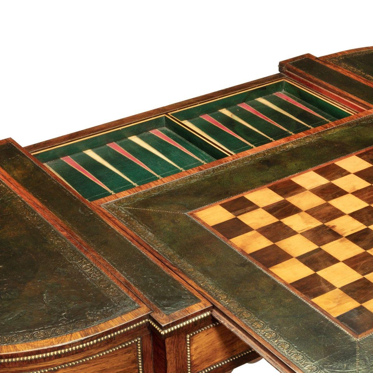 A Regency rosewood games table attributed to Gillows