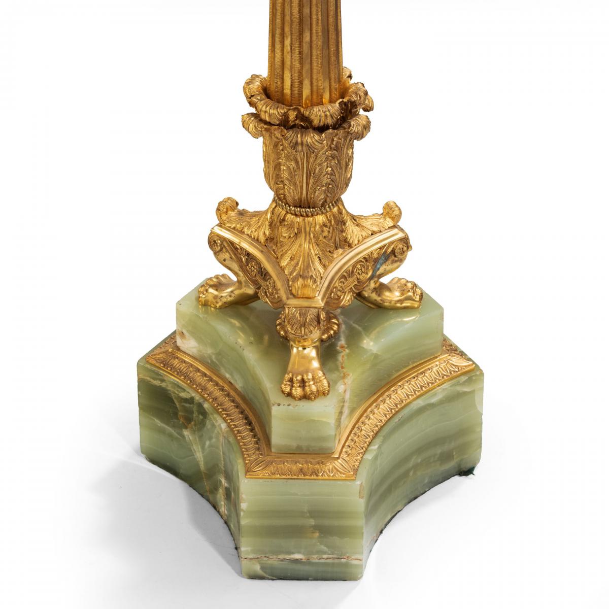 A large pair of onyx and ormolu lamps