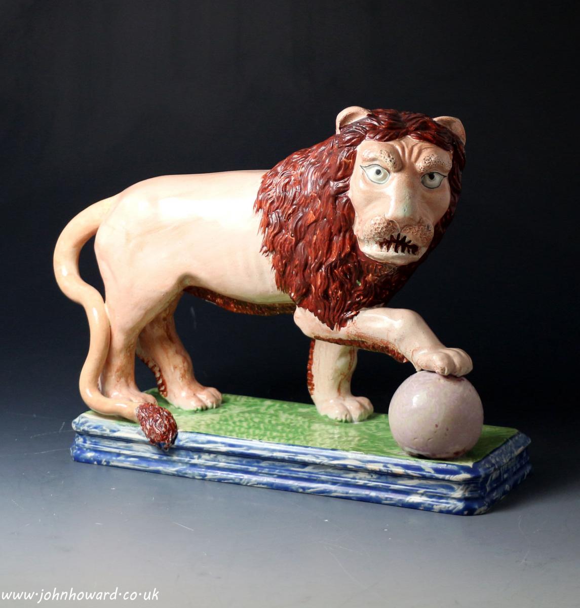 Antique Staffordshire pearlware figure of an angry lion standing on base early 19th century