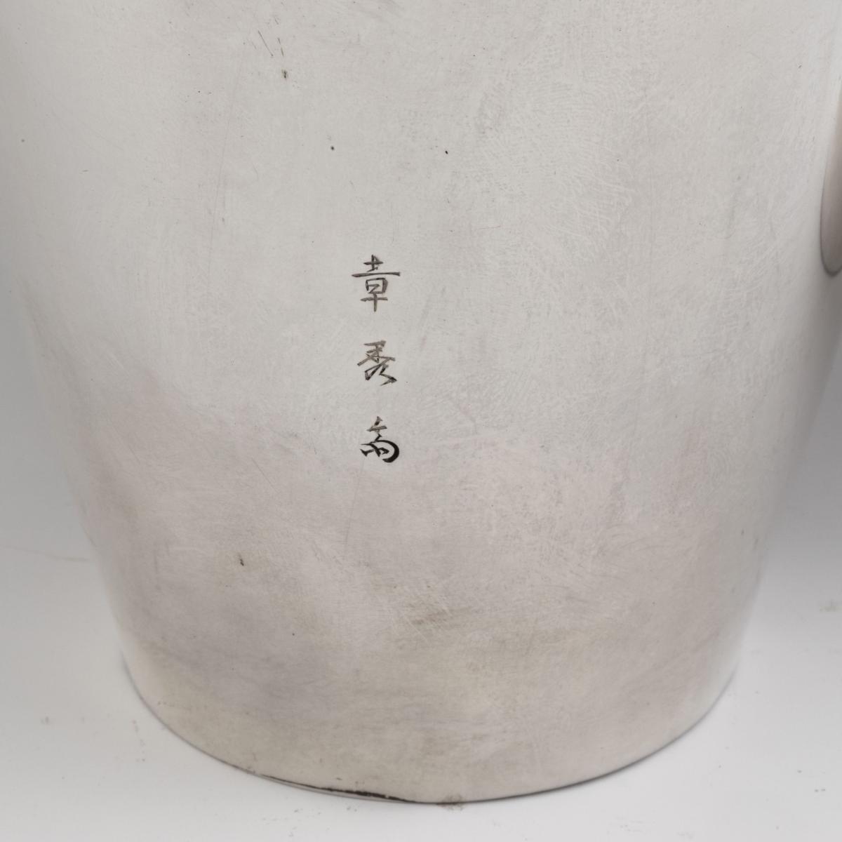 A pair of Taisho period silver vases