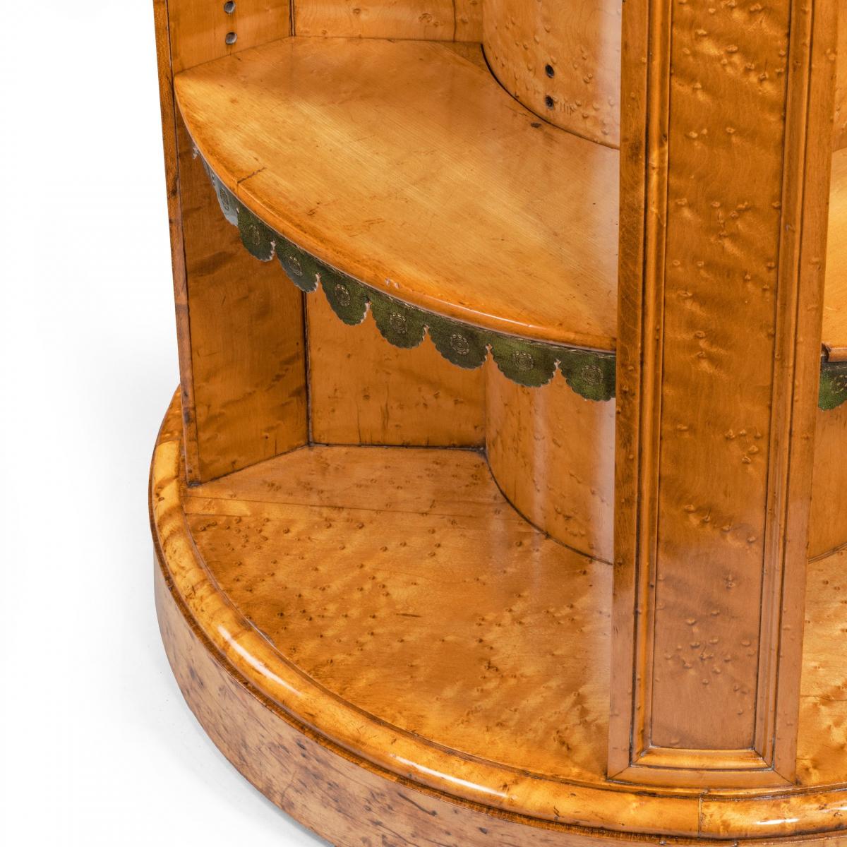 A late Regency bird’s eye-maple cylindrical open bookcase attributed to Gillows