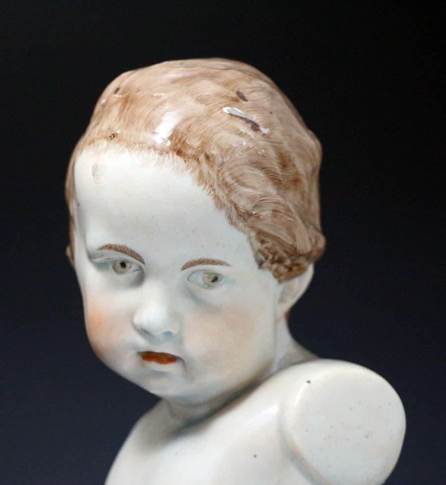 Staffordshire pearlware bust of a putto on a socle base, early 19th century