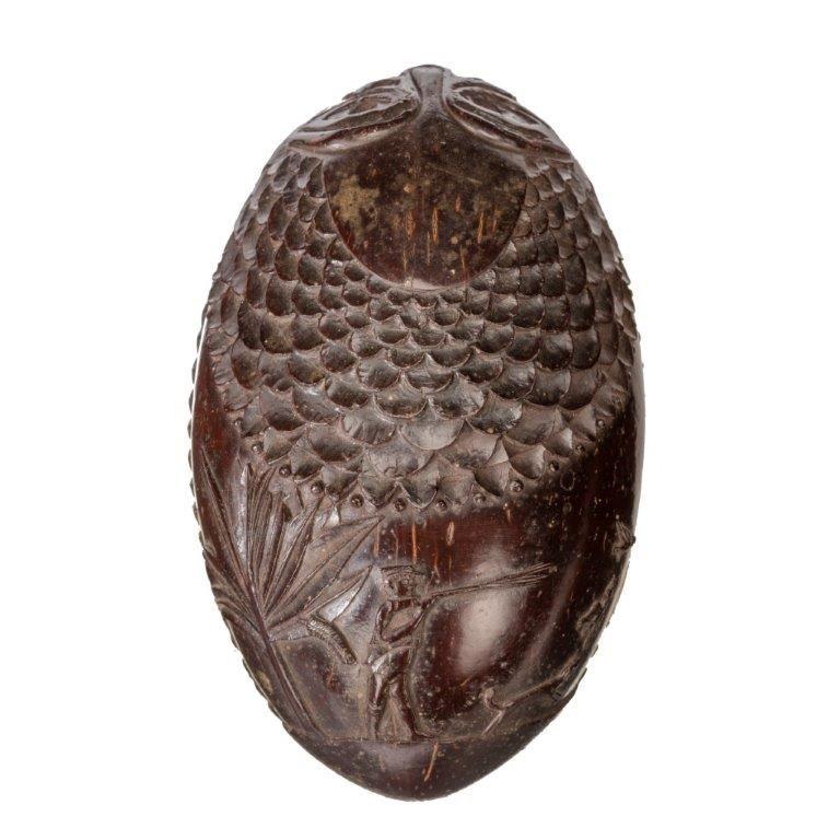 A naïve coconut shell “bugbear” powder flask carved as a fish