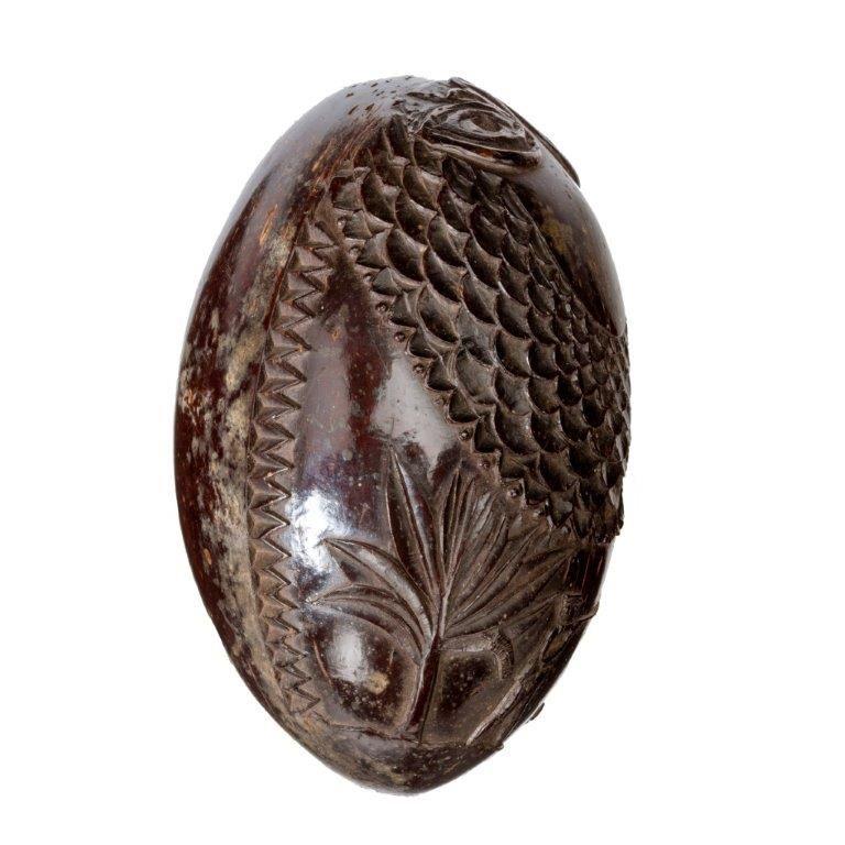 A naïve coconut shell “bugbear” powder flask carved as a fish