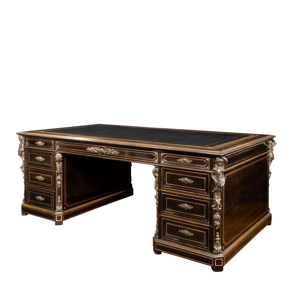 A large Napoleon III ebonized partners’ desk