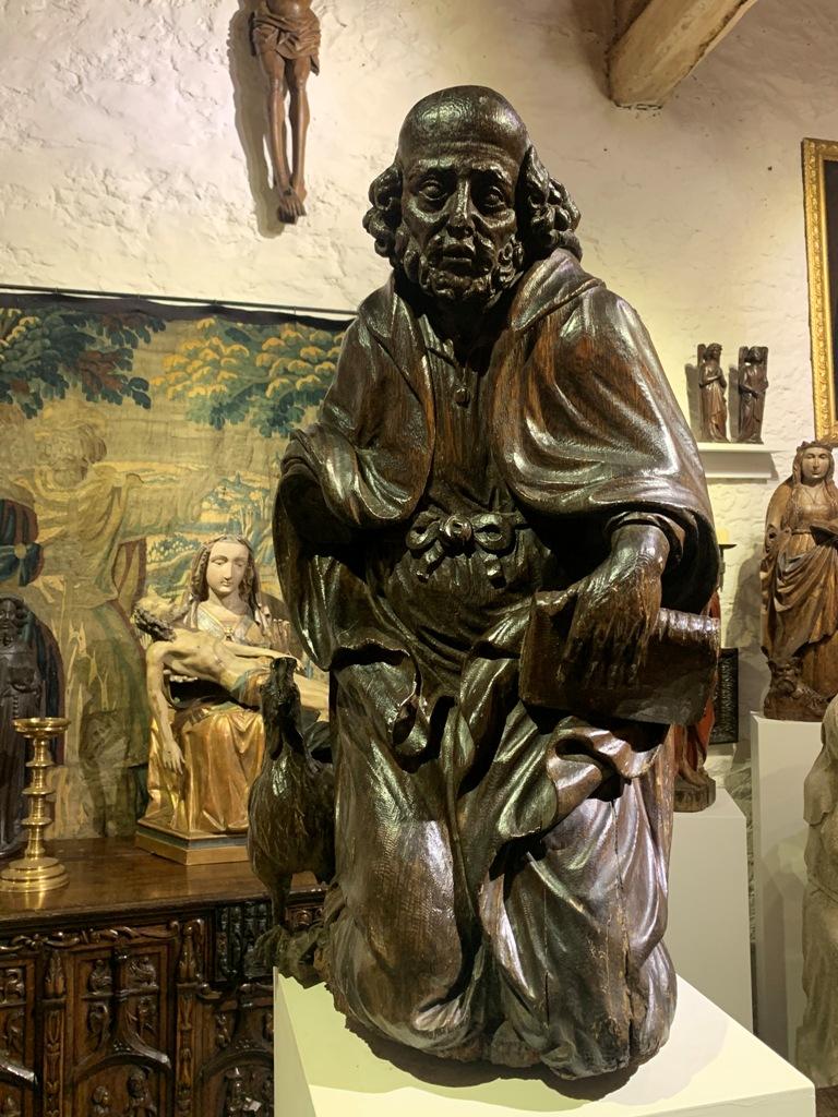 A WONDERFULL AND RARE LATE 15TH CENTURY OAK SCULPTURE OF "THE DENIAL OF ST PETER". CIRCA 1480-1500.