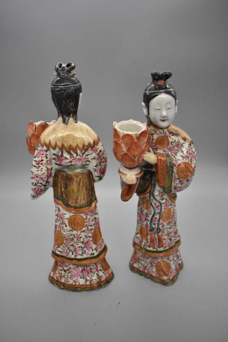 A pair of famille-rose figures candle holders