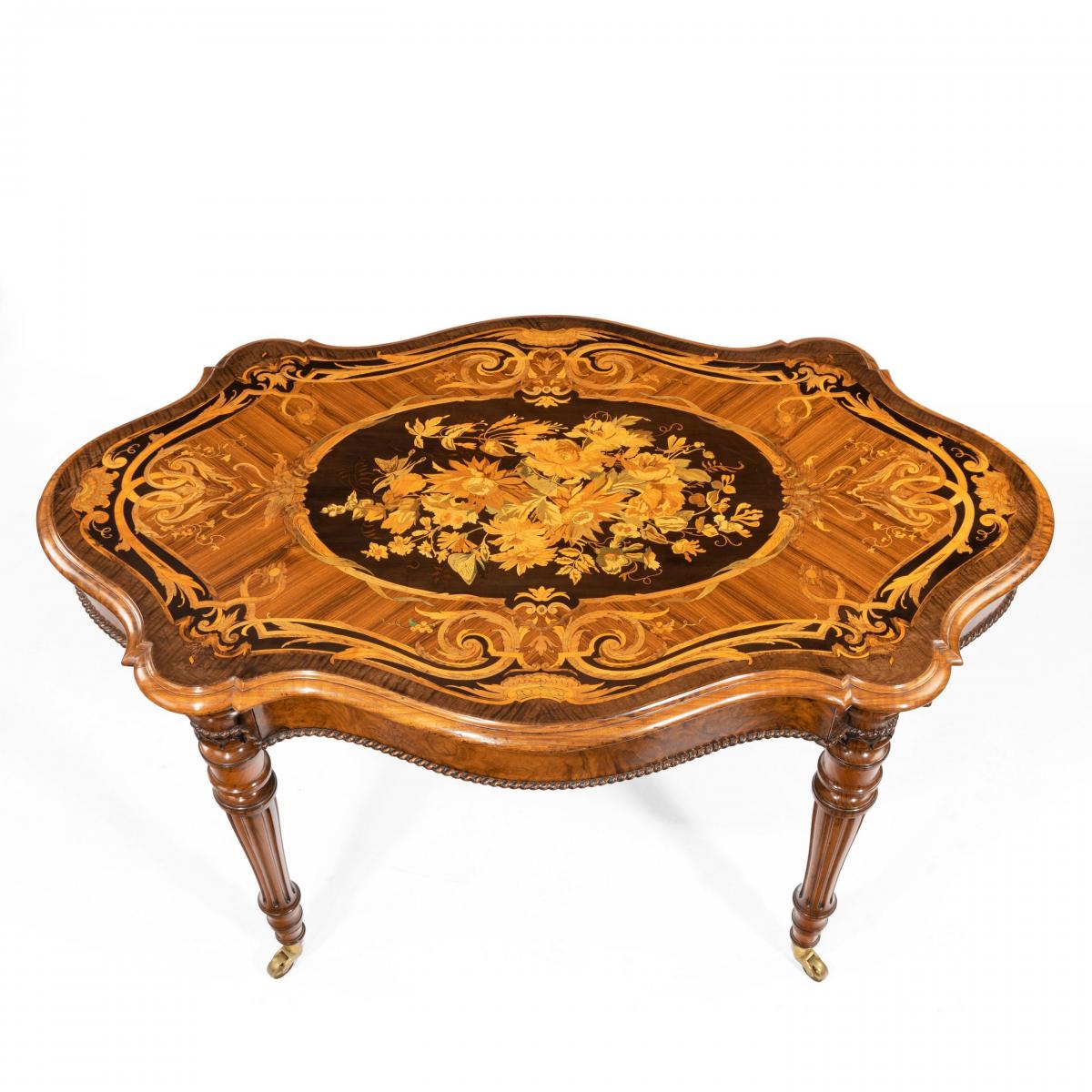 A Victorian burr walnut marquetry library table