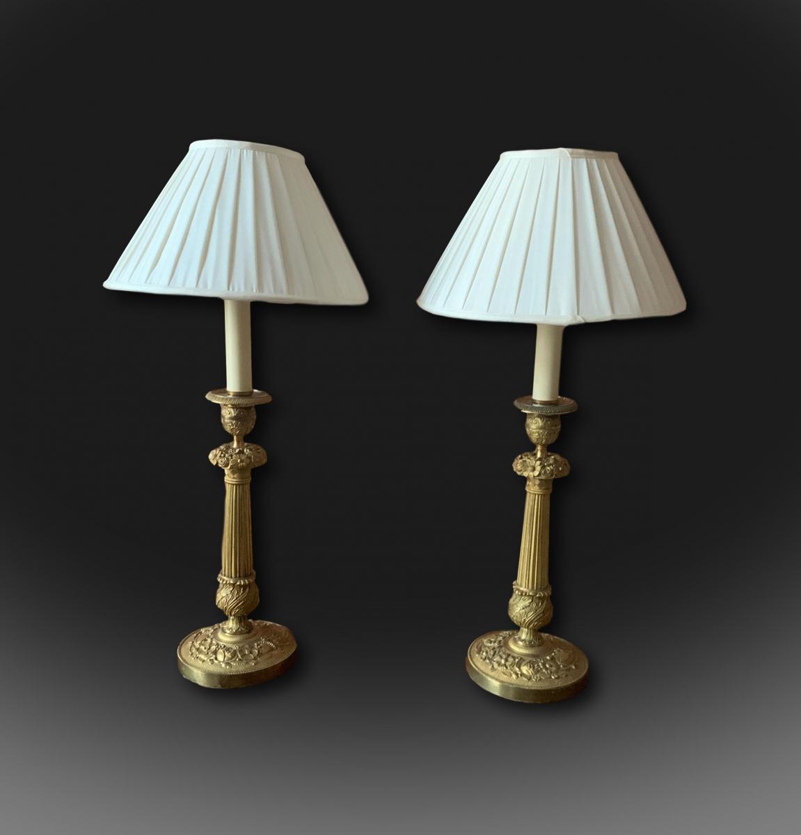 A pair of early 19th century French candlesticks converted to lamps