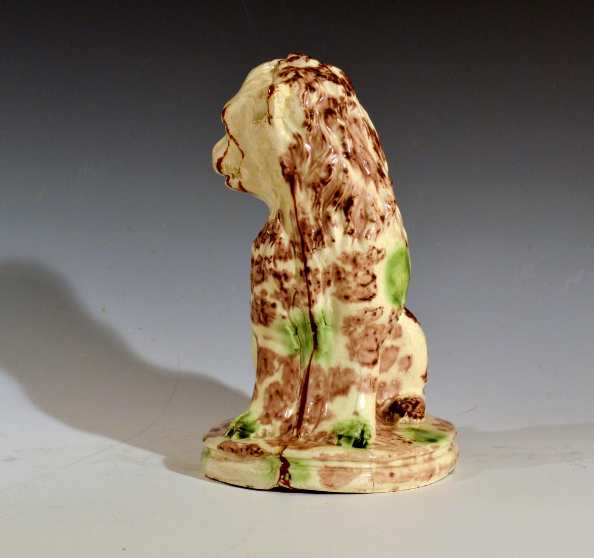English Pottery Whieldon-type Creamware Model of a Seated Lion, 18th century.