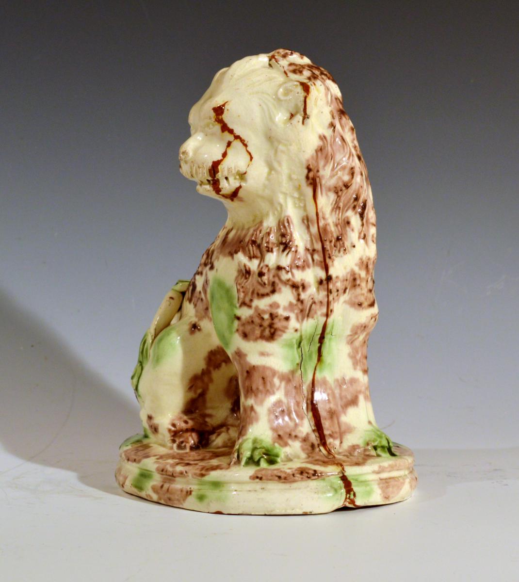 English Pottery Whieldon-type Creamware Model of a Seated Lion, 18th century.