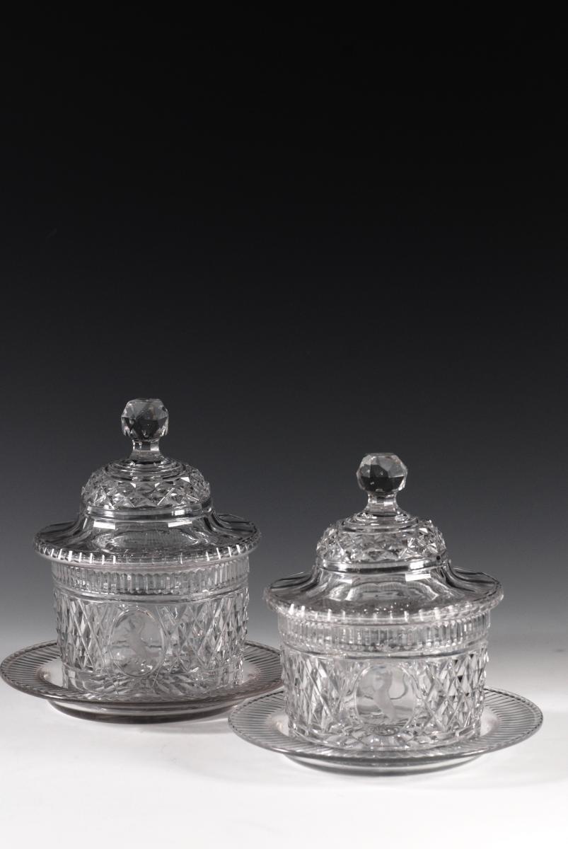 A pair of butter dishes