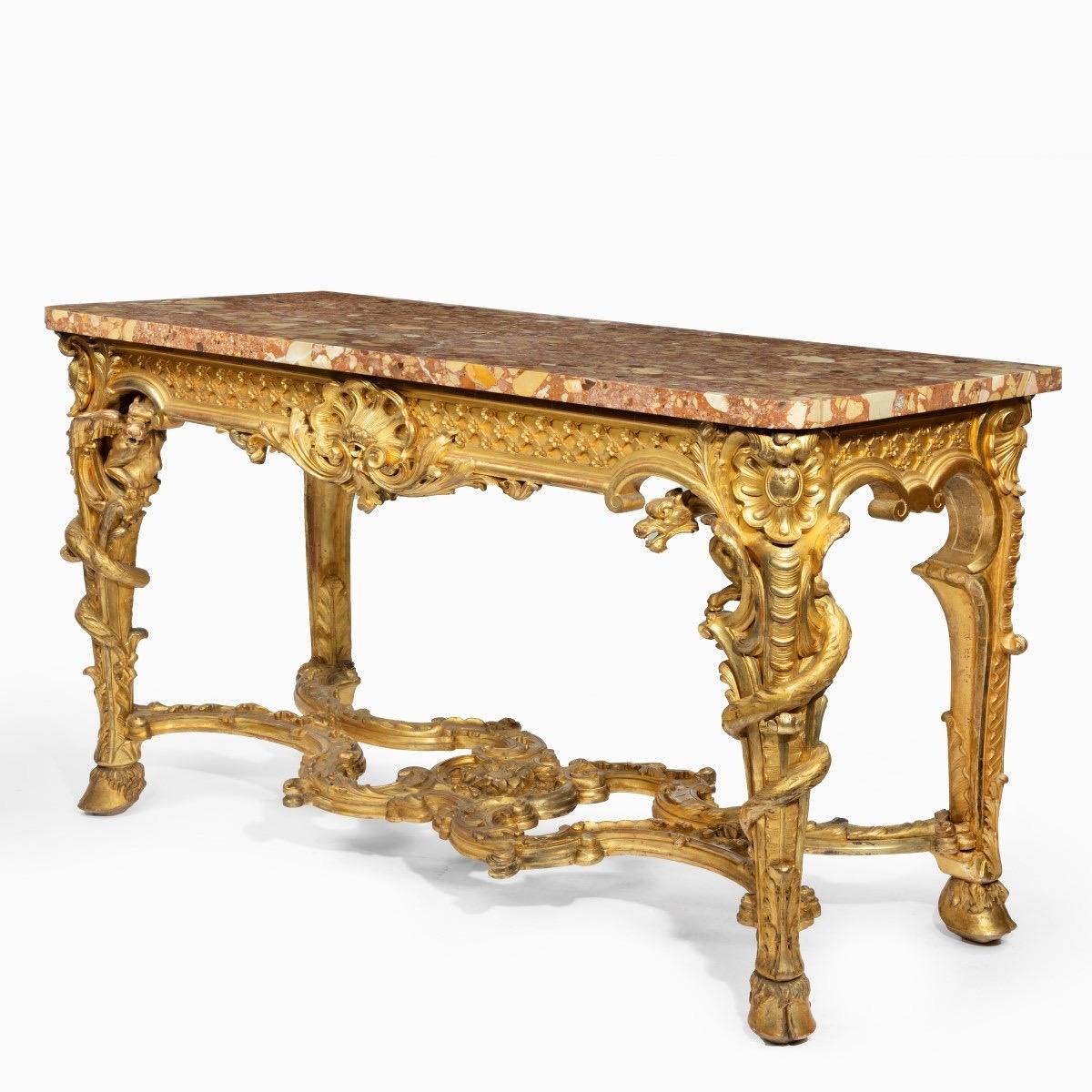 A superb pair of giltwood console tables with original marble tops
