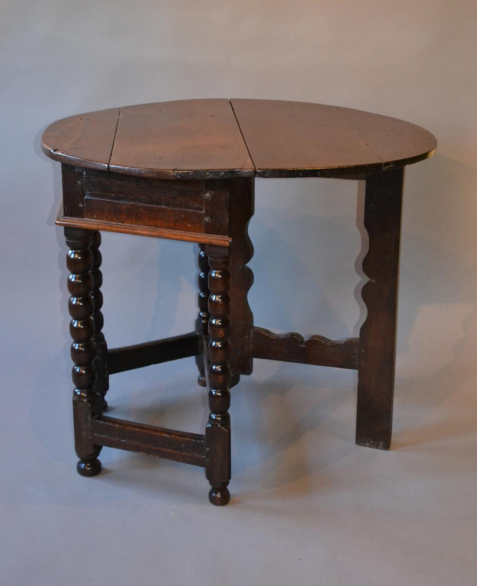 A Charles II oak credence table