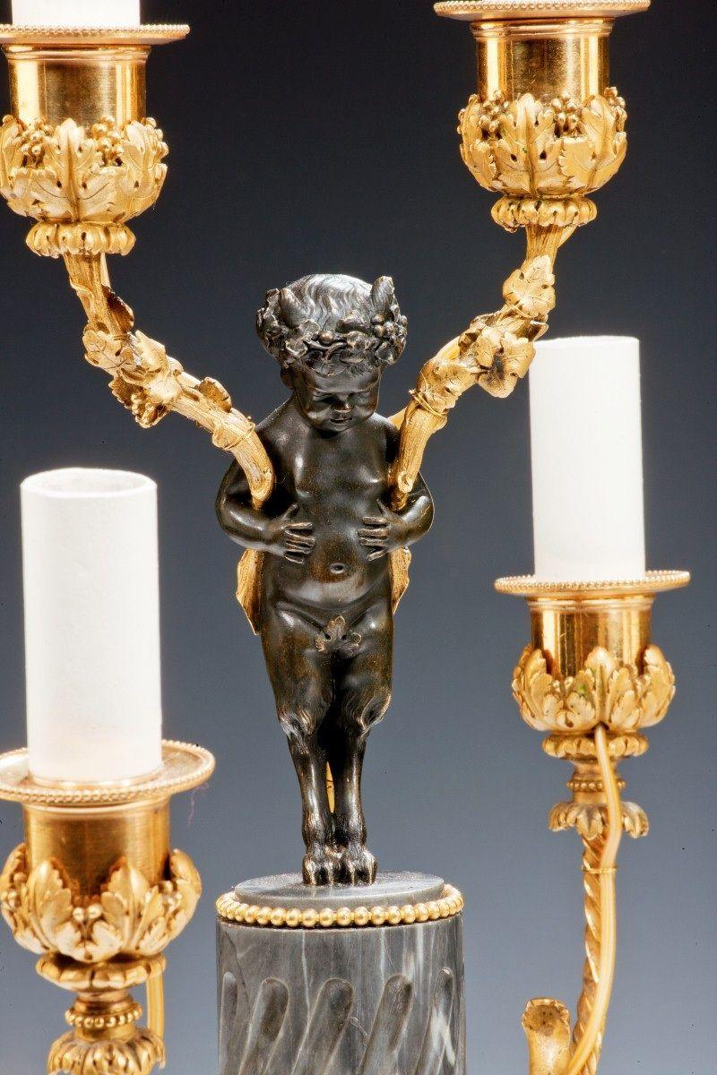 A pair of Napoleon III six-light candelabra