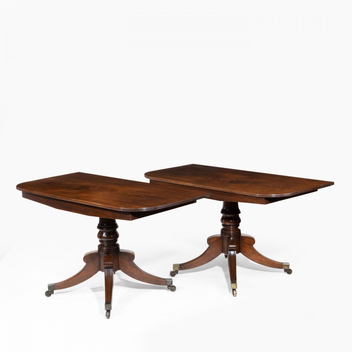George III pair of mahogany console tables which convert into a twin pillar dining table