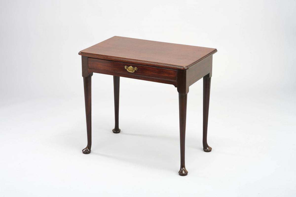A matched pair of George II period ‘red walnut’ side-tables
