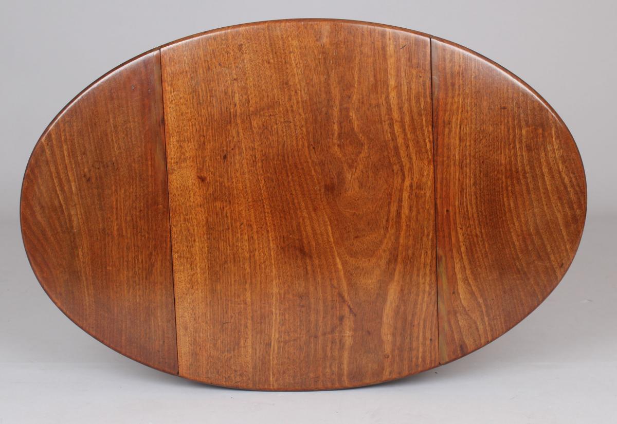 A George III period mahogany small oval Pembroke table