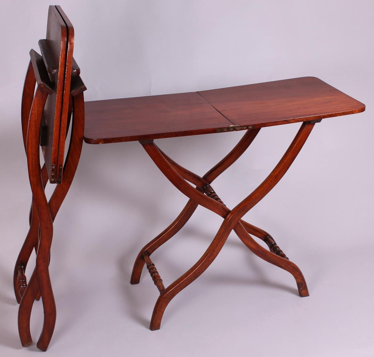 A matched pair of 19th century mahogany ‘coaching’ tables