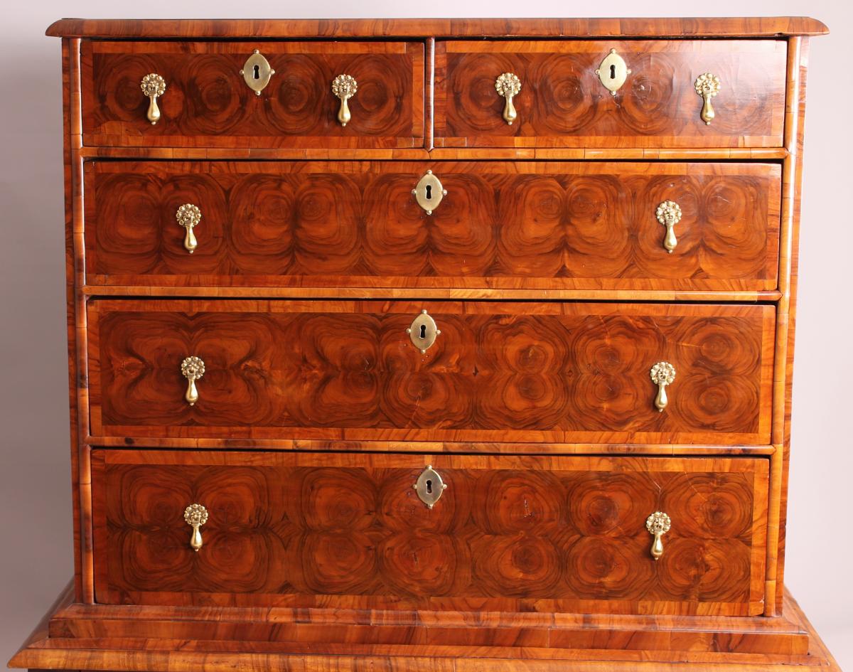 A fine and rare walnut oyster-piece chest-on-stand
