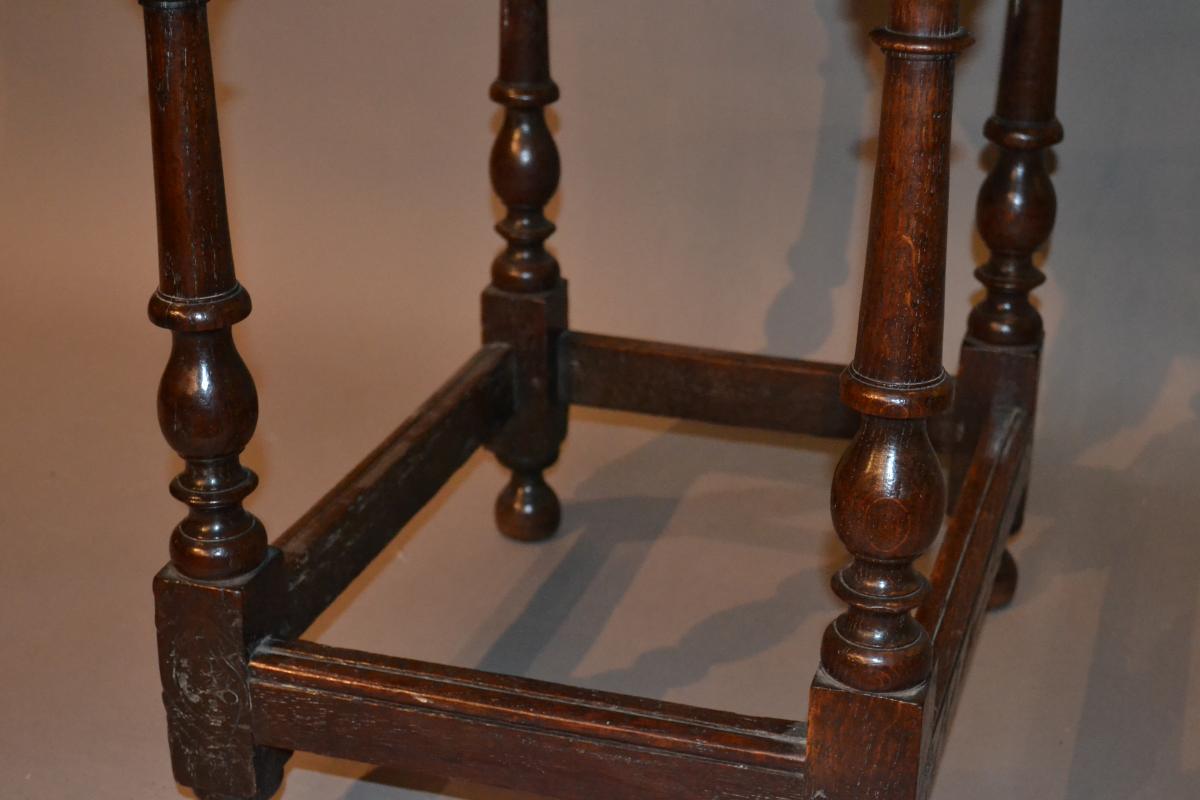 A very small early 18th century oak centre table