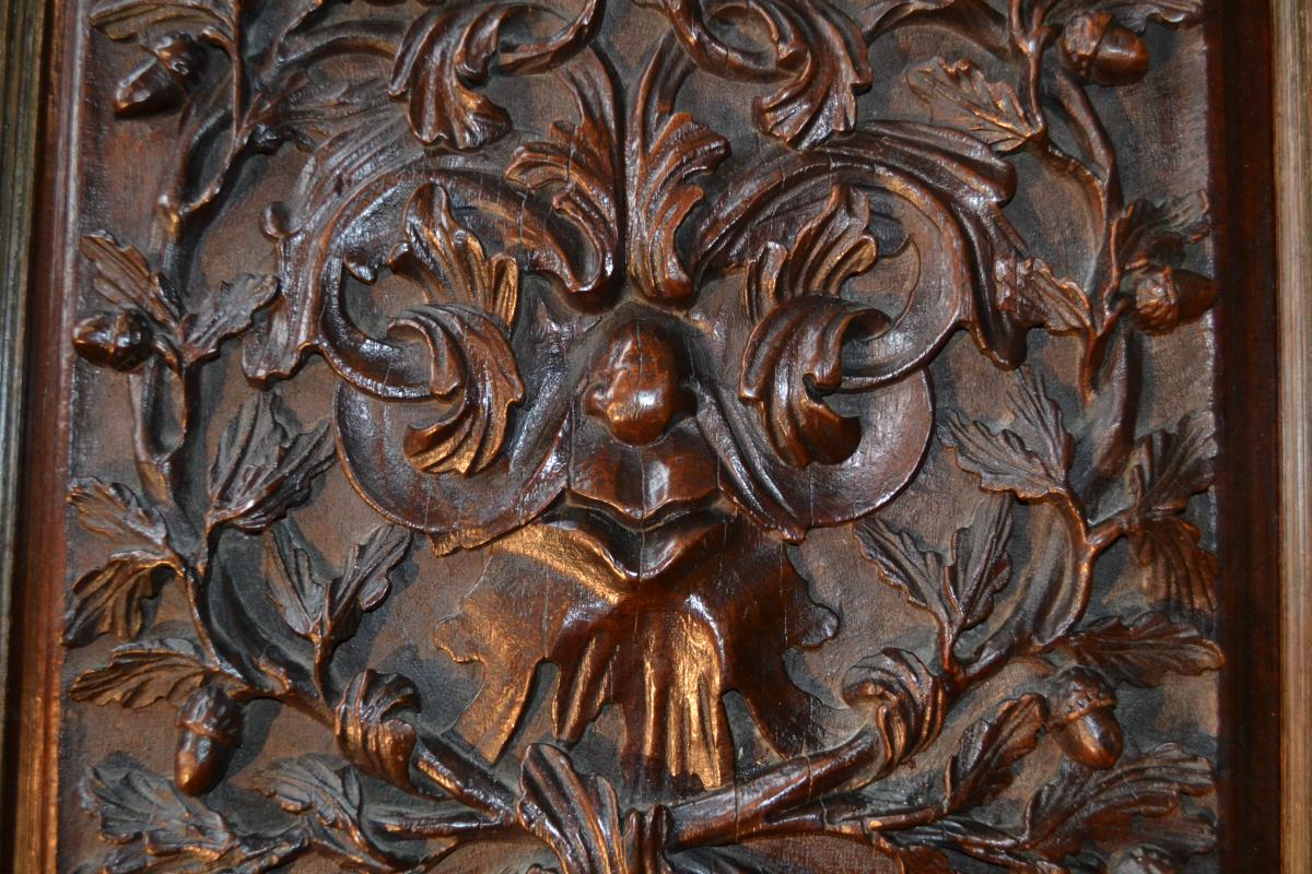 A large 18th century walnut carved panel depicting a "Green Man"