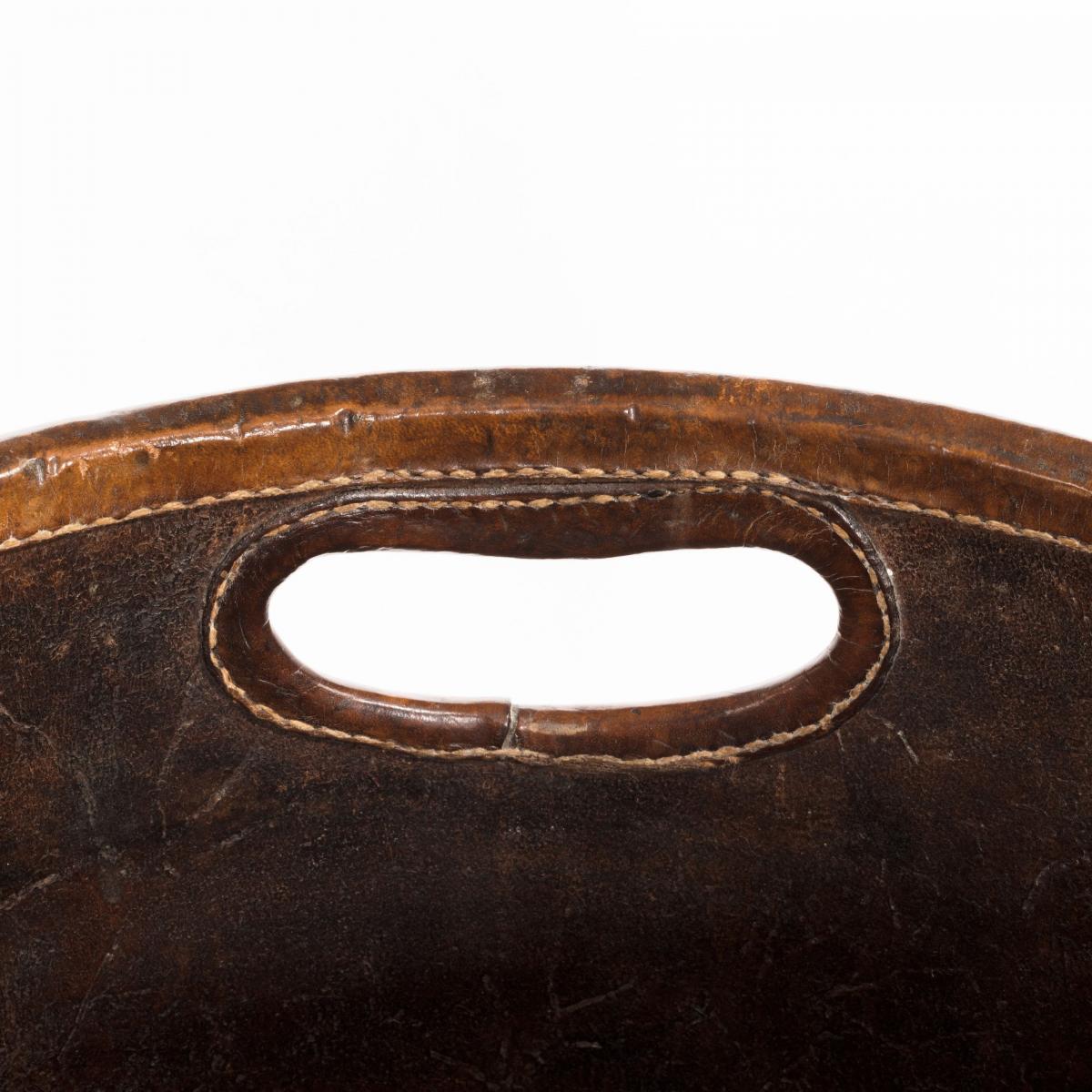 An Edwardian leather paper bucket