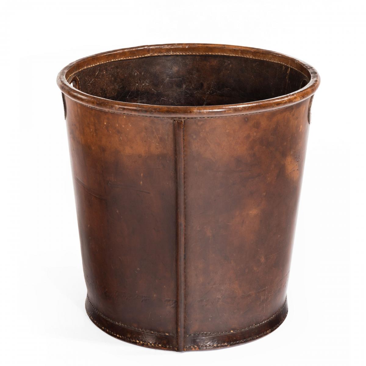 An Edwardian leather paper bucket