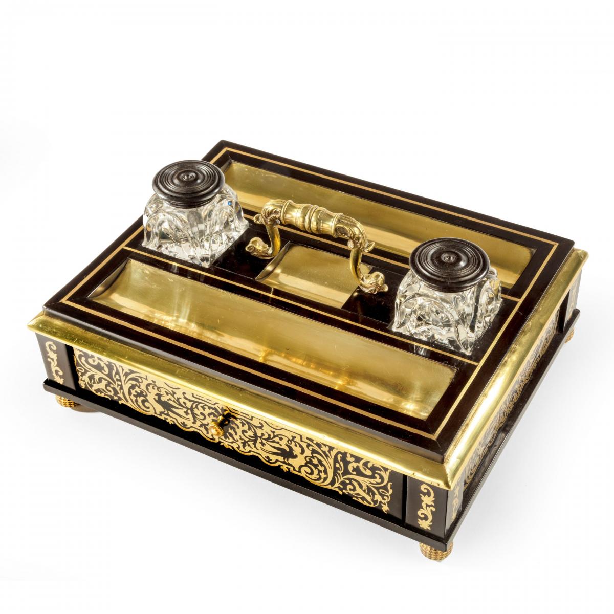 A Regency brass-inlaid ebony desk compendium