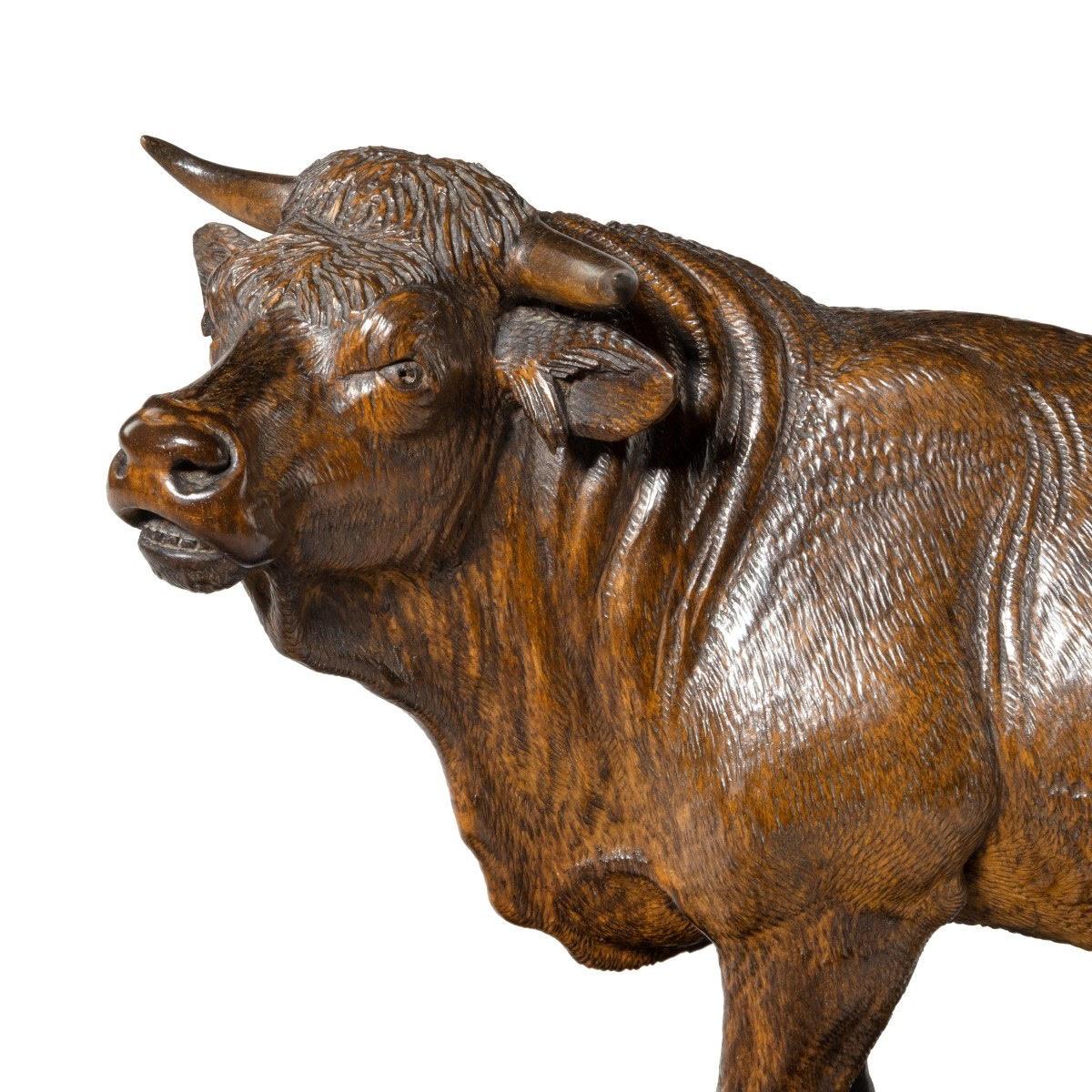 A Black Forest’ linden wood model of a standing bull