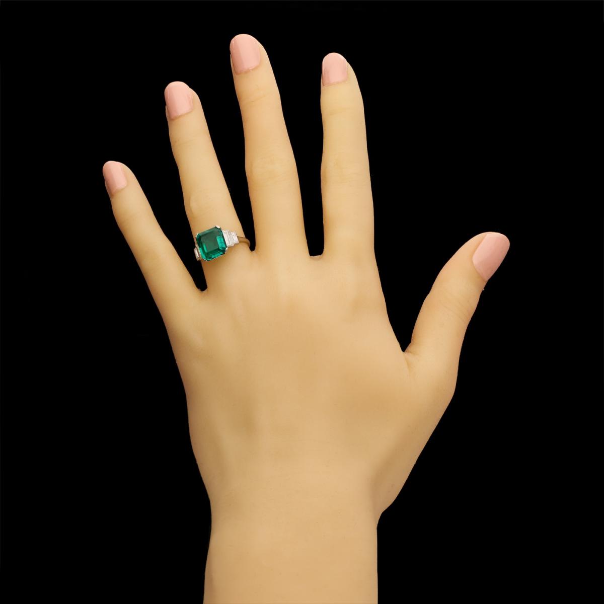A stunning 3.20ct Colombian emerald-cut emerald and baguette diamond ring