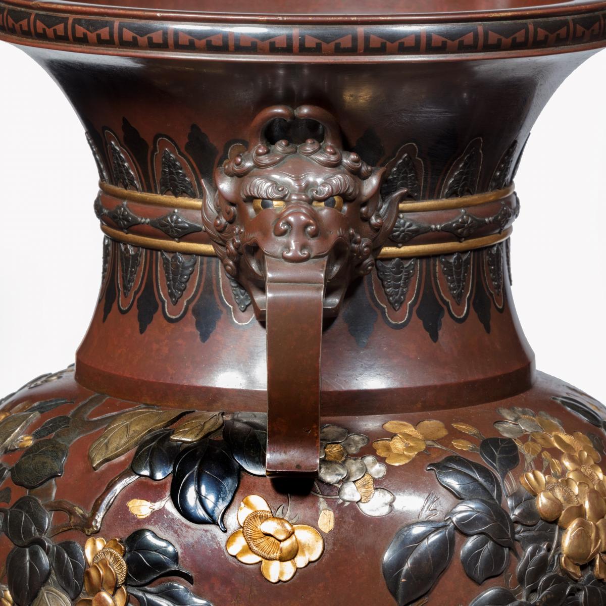 Meiji period rotating bronze and mixed metal vases