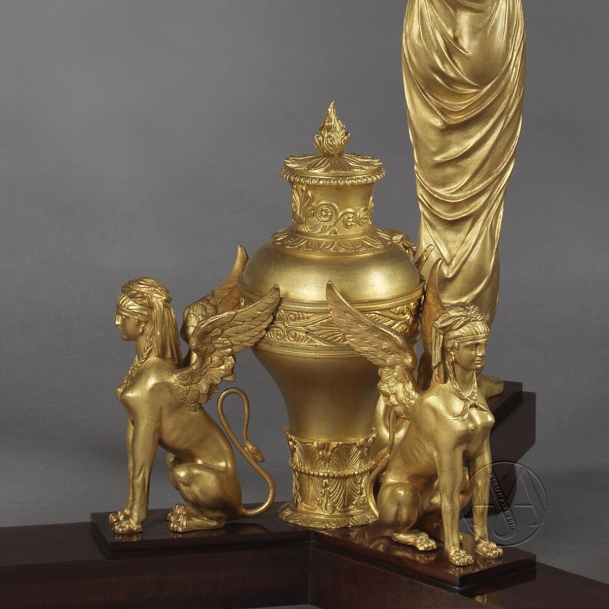 A detail of Fine Empire Style Gilt-Bronze and Mahogany Gueridon In The Manner of Jacob Desmalter