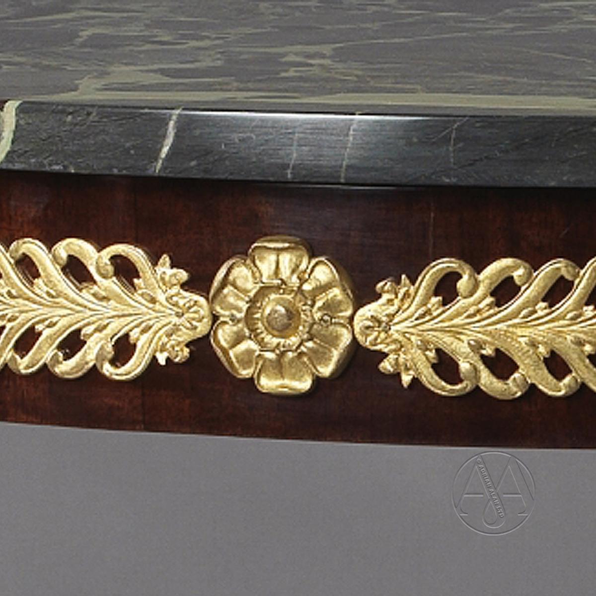 A detail of Fine Empire Style Gilt-Bronze and Mahogany Gueridon In The Manner of Jacob Desmalter