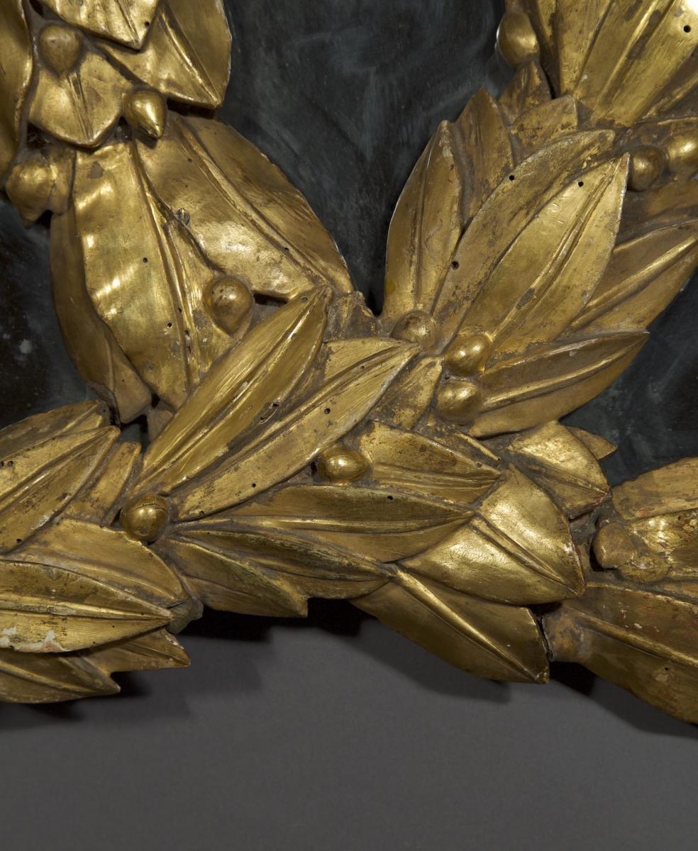 An Unusual Neoclassical Mirror In The Form Of Interlocking Laurel Wreaths, Retaining Its Original Gilding