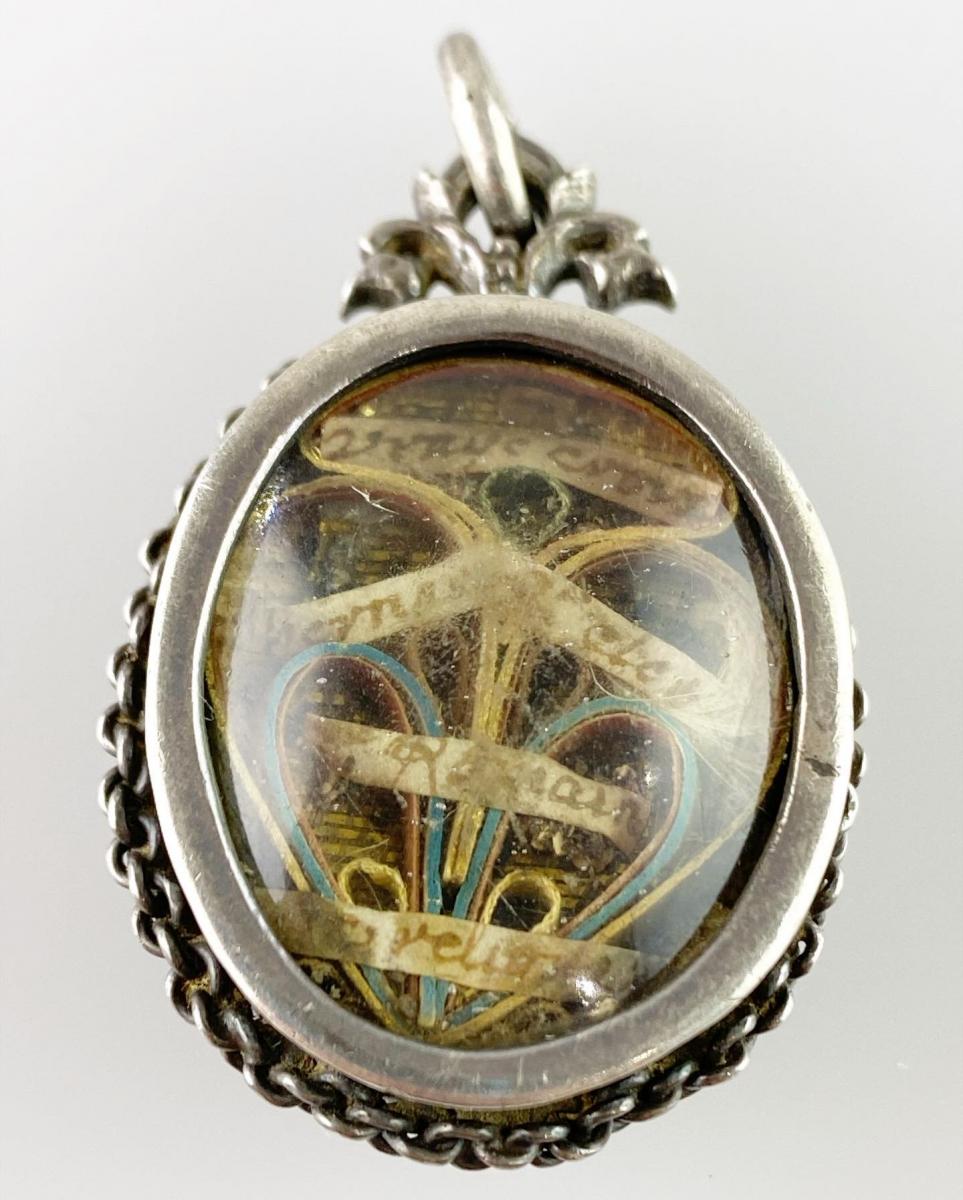 Double sided silver reliquary pendant. French, late 17th century.