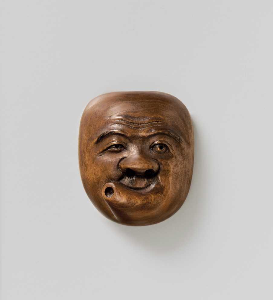 Wood mask netsuke of Usobuki by Gyokuyuki 
