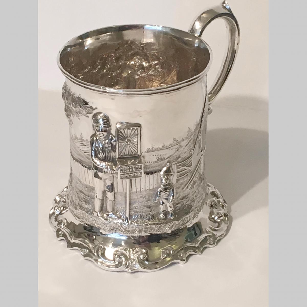 Antique 19th century English repoussé silver tankard