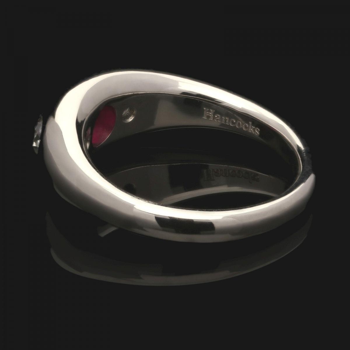 A beautiful platinum, ruby and old European cut diamond gypsy-set ring