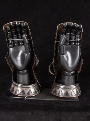 An exceptional pair of black and white mitten gauntlets_f