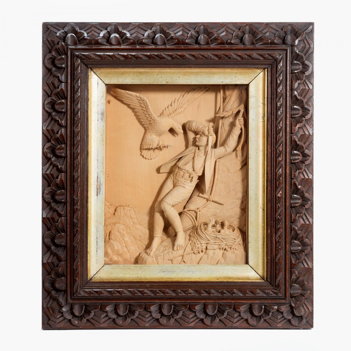 A pair of carved lime wood pictures