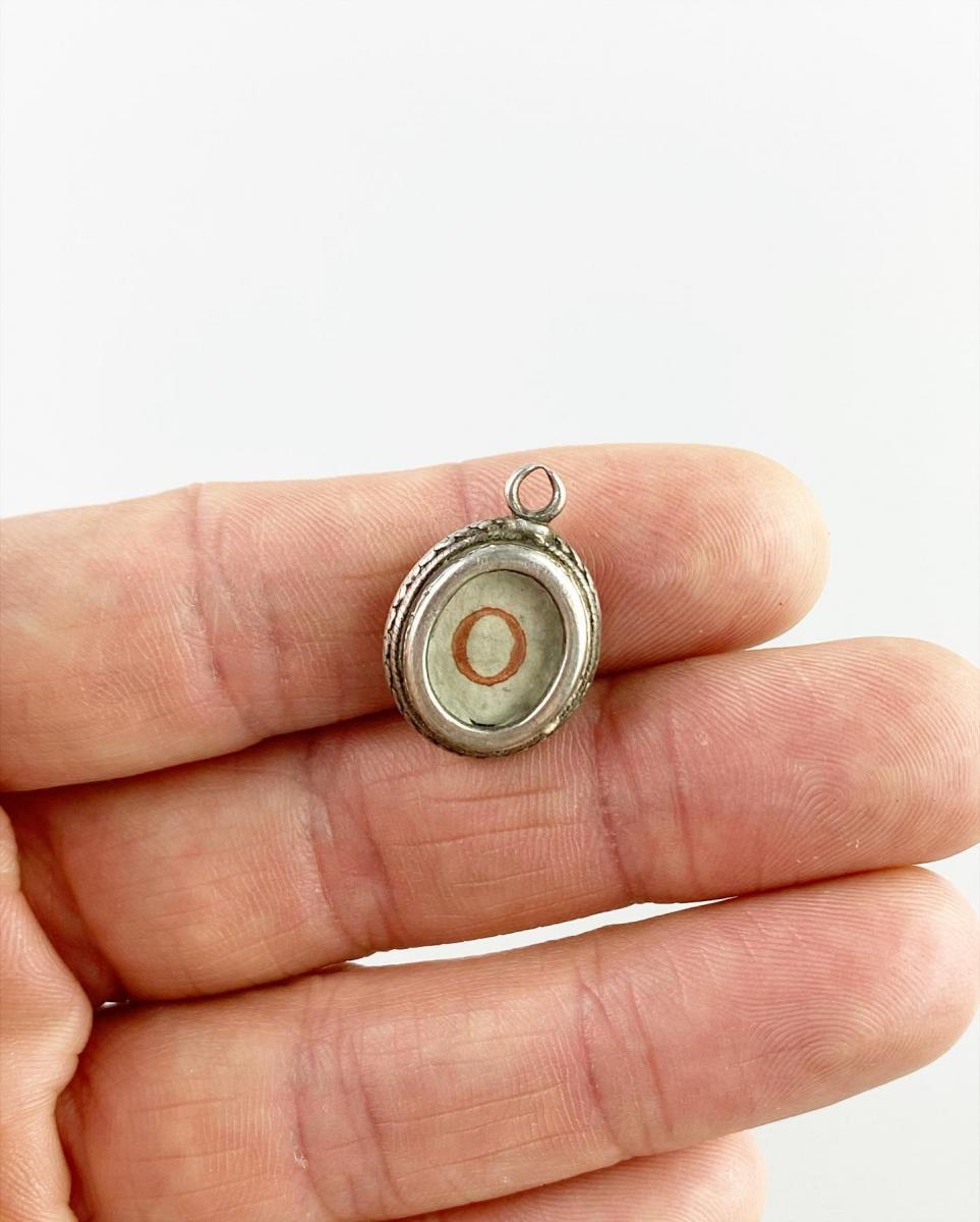 Silver 'O' reliquary pendant. Spanish, late 17th century